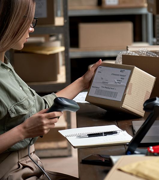 A woman opening a package.