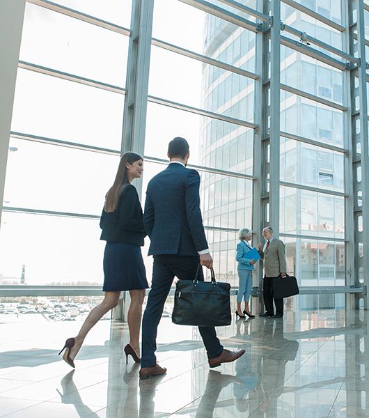 People walking through an office building.