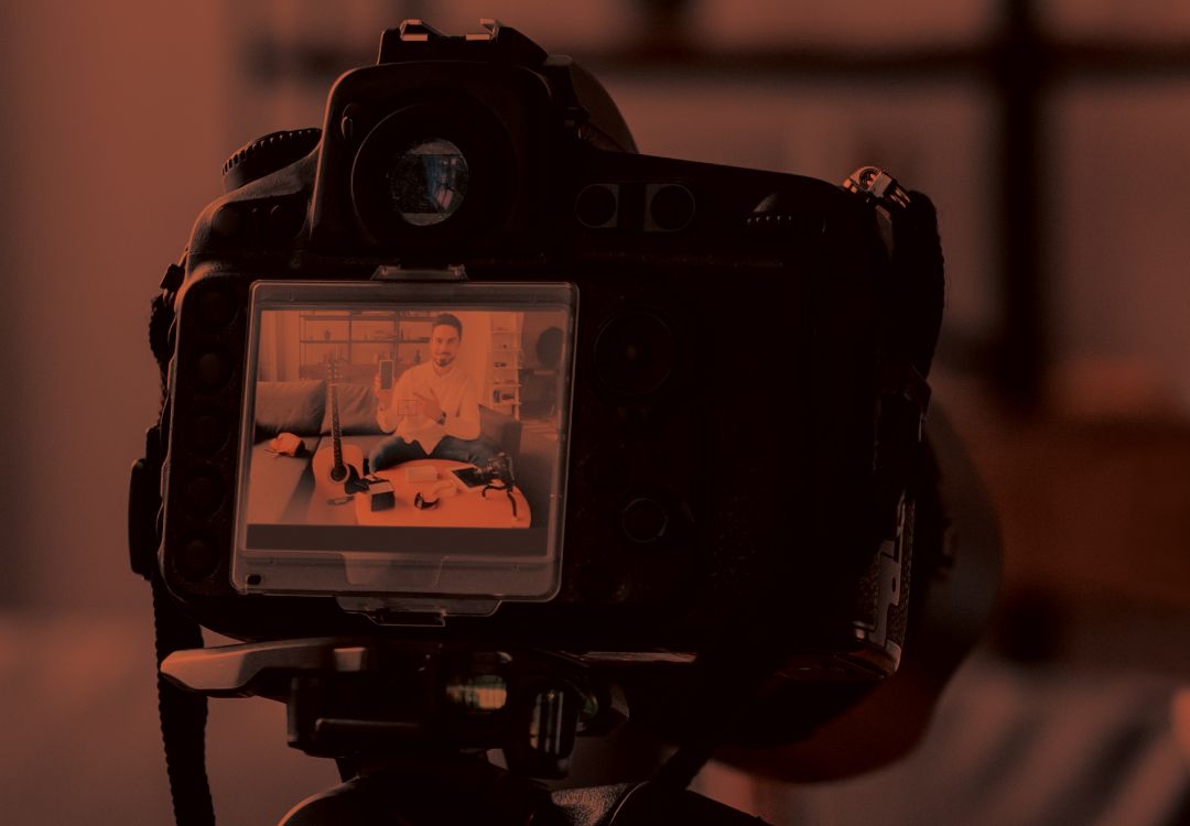 Man being filmed.